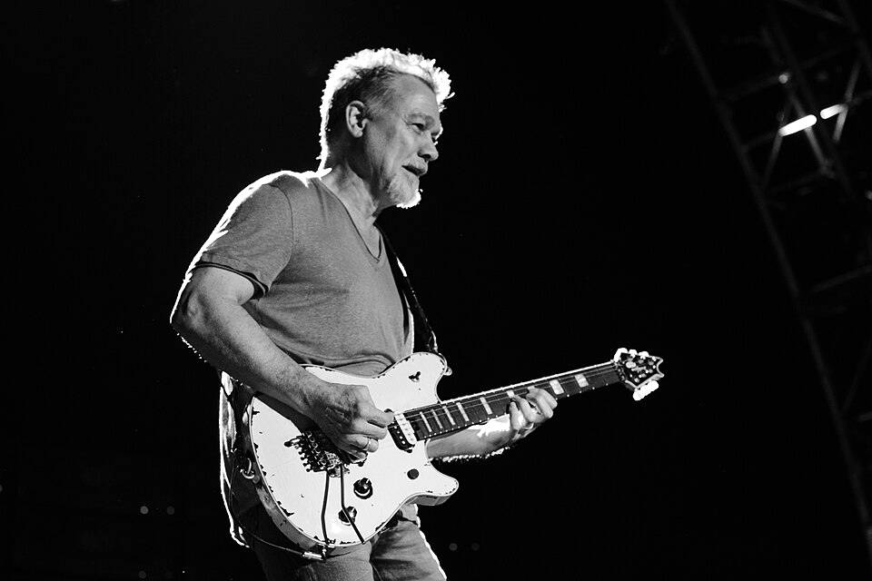 Eddie Van Halen playing guitar on stage, 2014
